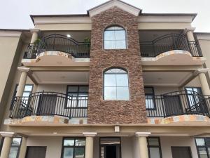 a building with balconies on the side of it at The Dunamis in Accra