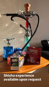 a desk with a lamp on top of a table at Kapparis Beach Escape, near beach, BBQ, free parking in Paralimni