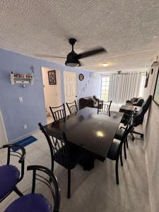 a dining room with a table and chairs at Escape Acapulco in Acapulco