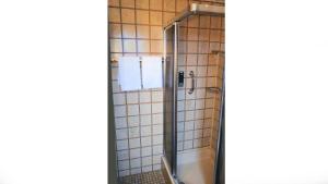 a bathroom with a shower with a sink and a tub at Hotel Garni Silberburg - Schwarzwald-Plus Karte in Bad Wildbad +73 photos