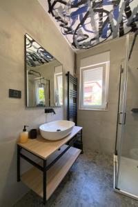 a bathroom with a sink and a mirror at Ema's double bedroom in Umag +38 photos