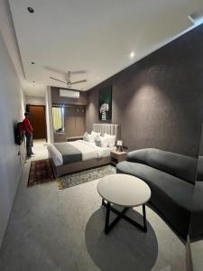 a hotel room with two beds and a table at Hotel route 54 in Bathinda