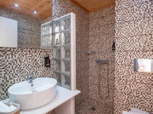 a bathroom with a sink and a shower at Galini Rooms in Naousa +31 photos
