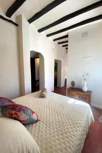 a bedroom with a large bed in a room at Hotel Masía de Altea in Altea +66 photos