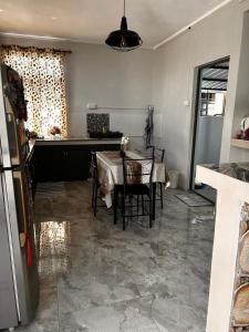 a kitchen with a table and chairs in a room at cozy home in Argy
