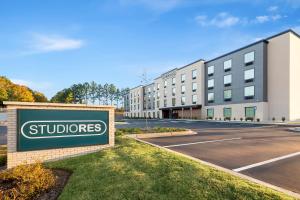 a sign in front of a building with a school at StudioRes by Marriott Memphis Cordova in Cordova