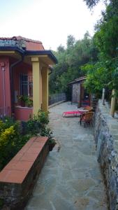 a house with a bench in front of it at Casa Bella Vista in La Spezia