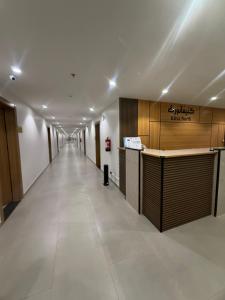 a long hallway with a bar in a building at فندق كتيفا نورث in Arar