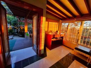 an open door to a room with a porch at Odara Pines Garden The Ridge House 1BR in Baguio