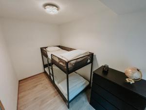 a room with two bunk beds and a desk at Chez Dubuiss in Houffalize +4 photos