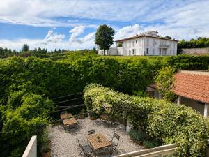 a room with chairs and a table and a building at Due Strade APT - Oltrarno Collection in Florence
