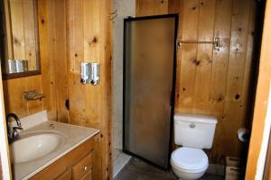 a bathroom with a toilet and a sink at Drakesbad Guest Ranch in Chester +43 photos
