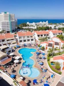 an aerial view of a resort with a swimming pool at Garden City apartment Costa Adeje in Costa de Adeje