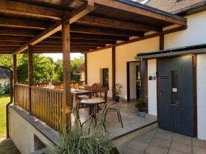 an outdoor patio with a table and chairs at hostinec Thérése in Petrovice