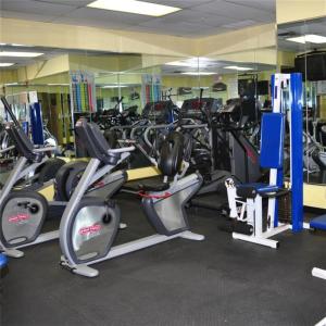 a gym with a lot of treadmills and cardio machines at Palm Beach Shores Resort and Vacation Villas in Palm Beach Shores