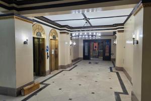 a hallway of a building with doors and a ceiling at Sleek 2BR apartment in prime location in Reading