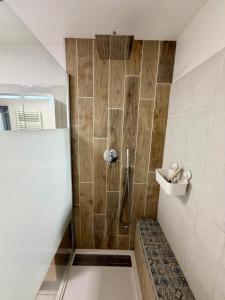 a bathroom with a shower with a bench in it at Pays Basque Ciboure - calme, port & plages à pied in Ciboure +13 photos
