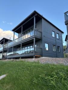 a large house with balconies on the side of it at Panorama 3 Kungsberget in Järbo