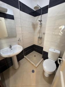 a bathroom with a toilet and a sink at Oasis Bay Lalzi in Lalzit Bay +31 photos