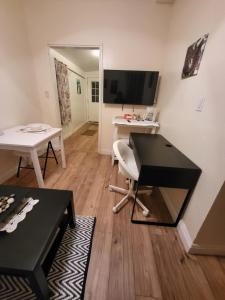 a living room with a desk and a chair at Guest house in Tujunga