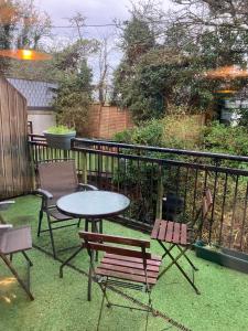 a table and two chairs and a table on a patio at Clifden townhouse in Clifden