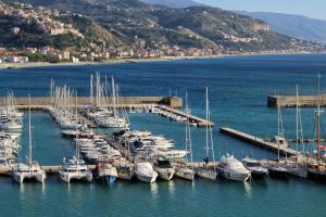 a group of boats docked at a dock in the water at La casa del Borgo in Cetraro