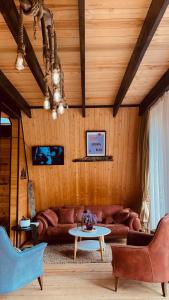 a living room with a couch and a table at Mtis Racha in Oni