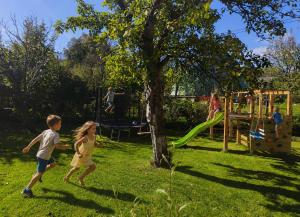 a group of children playing on a playground at Lipoffka in Lipova Lazne