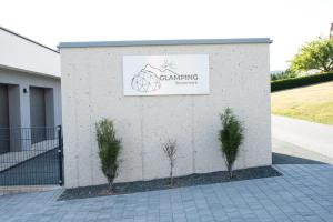 a building with a sign on the side of it at Glamping-Steiermark in Pöllauberg +39 photos