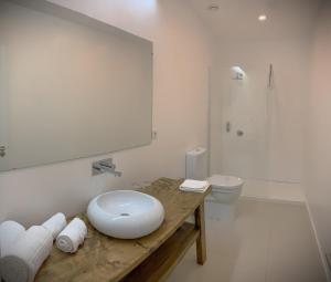 a bathroom with a sink and a toilet at Sunrise House 26 in Ponta Delgada +19 photos