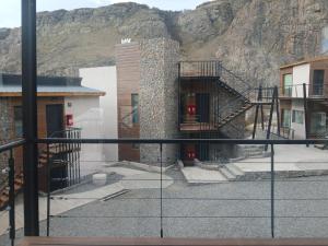 a view from a balcony of a building with a staircase at Panorama Aparts Chalten in El Chalten