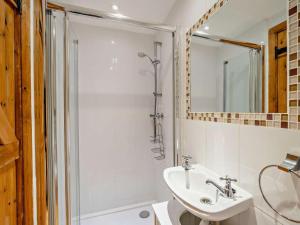 a white bathroom with a shower and a sink at 3 Bed in Langport oc-76372 in Drayton +12 photos
