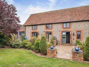 a brick house with a garden and a driveway at 3 Bed in Langport oc-76372 in Drayton
