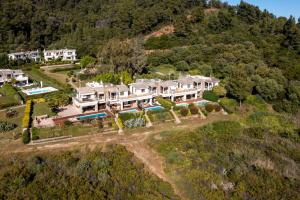 an aerial view of a large house on a hill at Villa Malvina in Neos Marmaras
