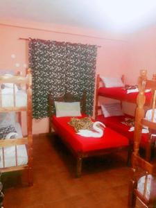 Ένα ή περισσότερα κρεβάτια σε δωμάτιο στο Pousada e Hostel Monalisa