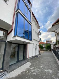 a building with large windows on the side of it at Venecia gold in Struga