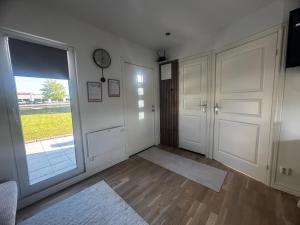 an empty room with a door and a window at Hammar Hus in Kristianstad