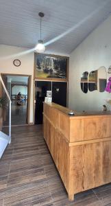a lobby with a wooden counter in a room at Pousada chafariz in Pirenópolis