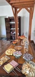 a table with a bunch of food on it at Pousada chafariz in Pirenópolis