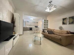 a living room with a couch and a table at sliema promenade in Sliema
