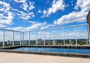 a view from the roof of a building with a swimming pool at Tulip Inn Bauru in Bauru