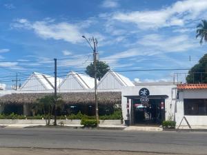 a store on the side of the street at Hotel Oasis Beach Club in Puntarenas +2 photos