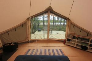 an inside view of a tent with a large window at Stamsjö Glamp in Åsele