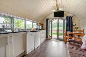 an open kitchen and living room in a tiny house at 1 Bed in Hereford oc-81293 in Aconbury +24 photos