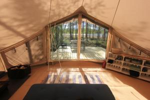 an inside view of a room with a large window at Stamsjö Glamp in Åsele +11 photos