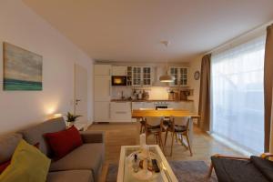 a living room with a couch and a table at Ostseekoje Prerow in Prerow
