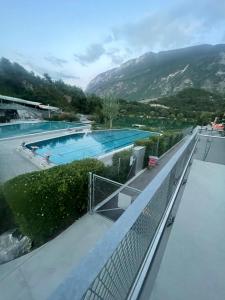 a view of a swimming pool with mountains in the background at Le rocher in Sierre