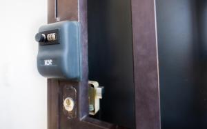 a wooden door with a blue box on it at Escape Turquesa in Los Algodones +4 photos