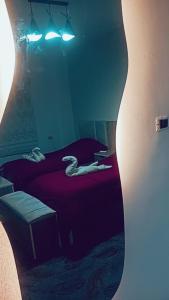 a woman laying on a bed in a room at Karak Castle House in Kerak