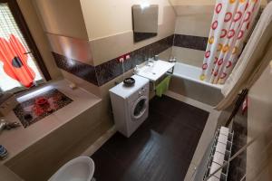 a small bathroom with a toilet and a sink at Casa sul fiume con giardino e terrazza in Pianello +36 photos